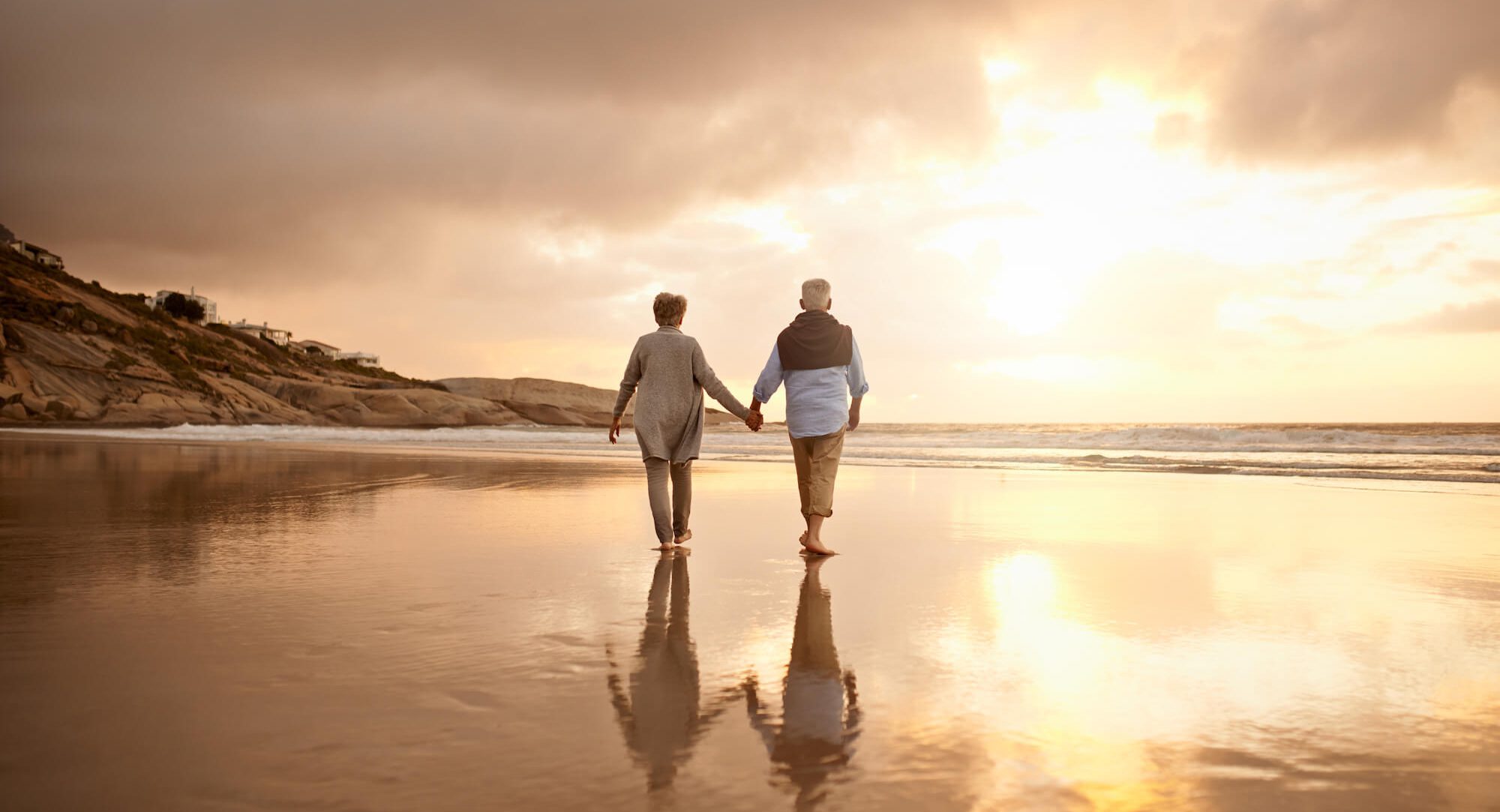Shot of a happy senior couple going for a walk on the beach